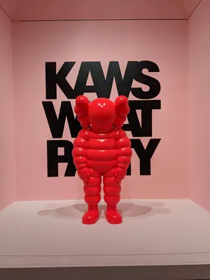 Red K A W S Figure Art Exhibit Wallpaper