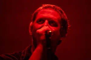 Red Lit Singer Performance Wallpaper