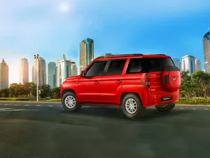 Red Mahindra T U V300 Urban Backdrop Wallpaper