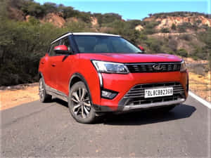 Red Mahindra X U V300 On Road Wallpaper