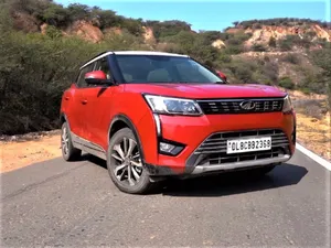 Red Mahindra X U V300 On Road Wallpaper