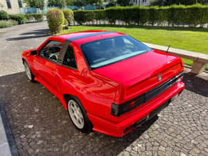 Red Maserati Shamal Parked Outdoors Wallpaper