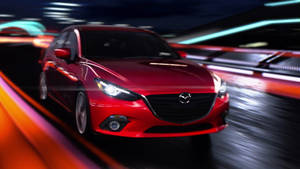 Red Mazda 3 In Motion Wallpaper