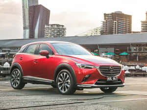 Red Mazda C X3 Urban Backdrop Wallpaper