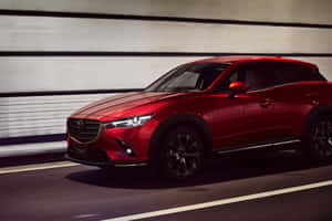 Red Mazda C X3in Motion Wallpaper