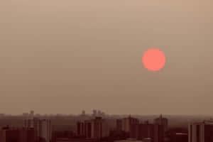 Red Moon Over Cityscape Wallpaper