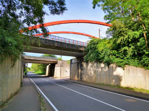 Red Pedestrian Bridge Over Road Schifflange Wallpaper