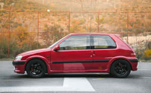 Red Peugeot106 Side View Wallpaper