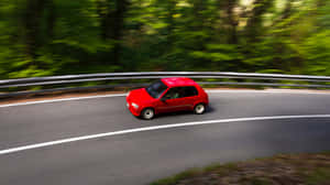 Red Peugeot106 Speedingon Country Road Wallpaper