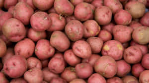 Red Potatoes On A Wooden Surface Wallpaper