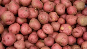 Red Potatoes On A Wooden Surface Wallpaper