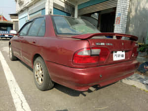 Red Proton Wira Rear View Wallpaper