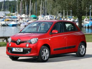 Red Renault Twingo Marina Backdrop Wallpaper