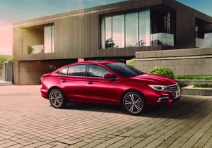 Red Sedan Outside Modern Home Wallpaper