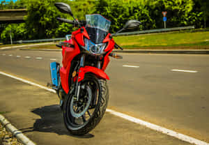 Red Sport Motorcycle Parked Roadside Wallpaper