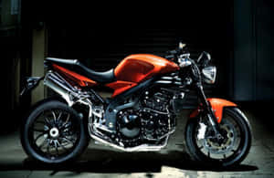 Red Sport Motorcyclein Dark Garage Wallpaper