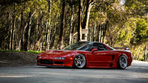 Red Sports Car Forest Road Wallpaper