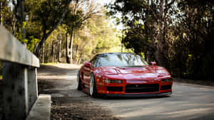 Red Sports Car In Nature Wallpaper