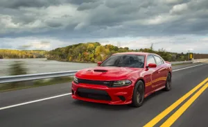 Red Sports Car Speeding On Highway Wallpaper