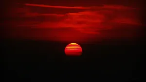 Red Sunset Over The Water Wallpaper