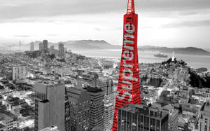 Red Supreme Logo On Skyscraper Wallpaper