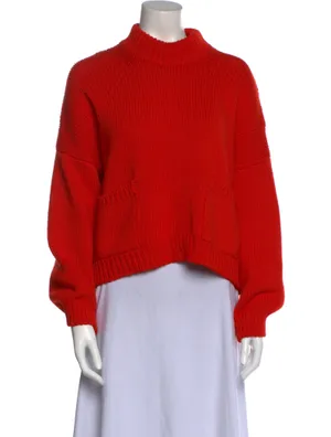 Red Sweater Hanging On A Hanger Wallpaper