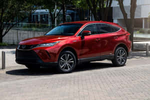 Red Toyota Venza Urban Setting Wallpaper
