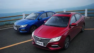 Redand Blue M G5 Sedans Parked Wallpaper