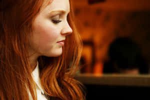 Redheaded Woman Profile View Wallpaper