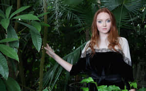 Redheaded Womanin Tropical Greenhouse Wallpaper