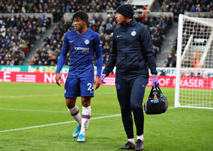 Reece James Walking Alongside Staff Wallpaper