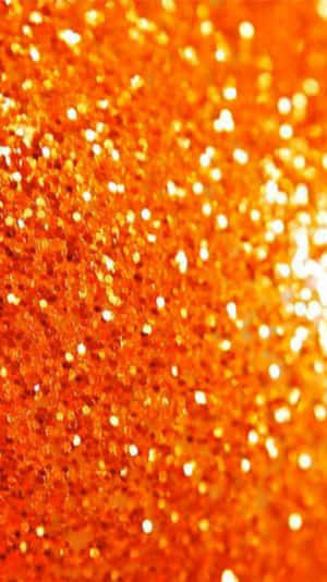 Reflecting The Beauty Of Orange Glitter Wallpaper