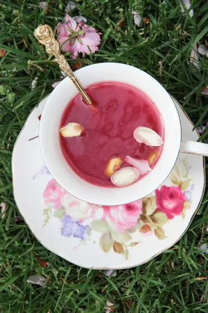 Refreshing Pink Tea In An Elegant Glass Wallpaper