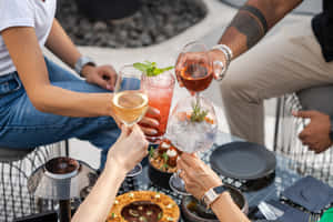 Refreshing Summer Drinks On A Beach Table Wallpaper