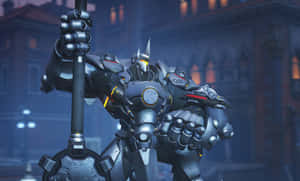 Reinhardt In Action During An Intense Overwatch Battle Wallpaper