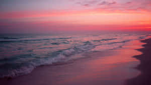 Relax And Enjoy The Beautiful Pink Beach Sunset Wallpaper