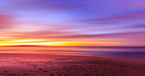 Relax On A Secluded Beach Under The Changing Sky Wallpaper