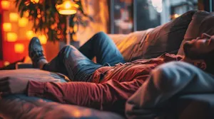 Relaxed Man Loungingon Couch Wallpaper