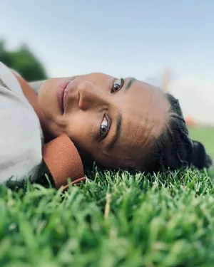 Relaxed Woman Lyingon Grass Wallpaper