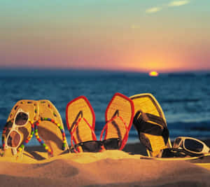 Relaxing Beach Sandals On A Sunny Shore Wallpaper