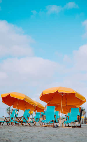 Relaxing Beach Scene With Colorful Umbrella Wallpaper