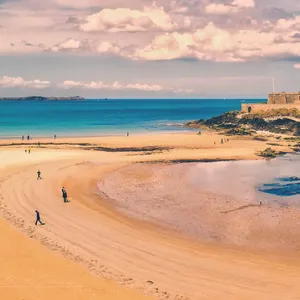 Relaxing Beach Walk At Sunset Wallpaper