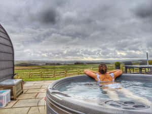 Relaxing Countryside Hot Tub Experience Wallpaper