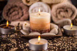 Relaxing Spa Experience Candlesand Towels Wallpaper