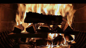 Relaxing Warmth Of A Cozy Fireplace Wallpaper