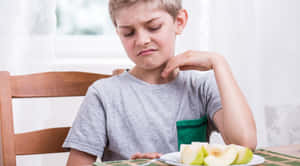 Reluctant Boy And Apples Wallpaper