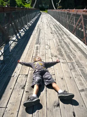 Reluctant Boy On Bridge Wallpaper