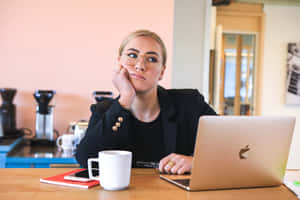 Reluctant Woman Looking Away From Laptop Wallpaper