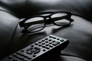 Remote Control And Eyeglasses Wallpaper