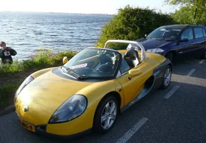 Renault Sport Spider Gliding Down The Road Wallpaper